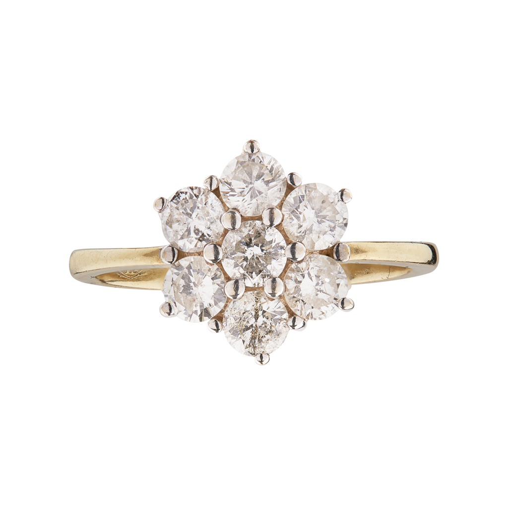 Appraisal: A diamond set cluster ring claw set with seven round