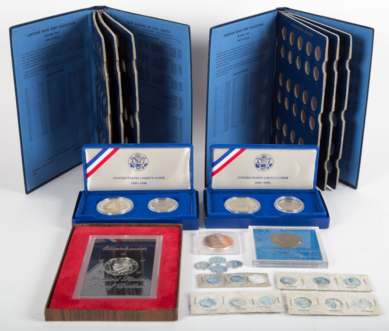 Appraisal: Comprising two s mint-boxed Liberty Coin sets each with a