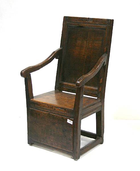 Appraisal: A Charles II oak wainscot armchair composed of antique elements