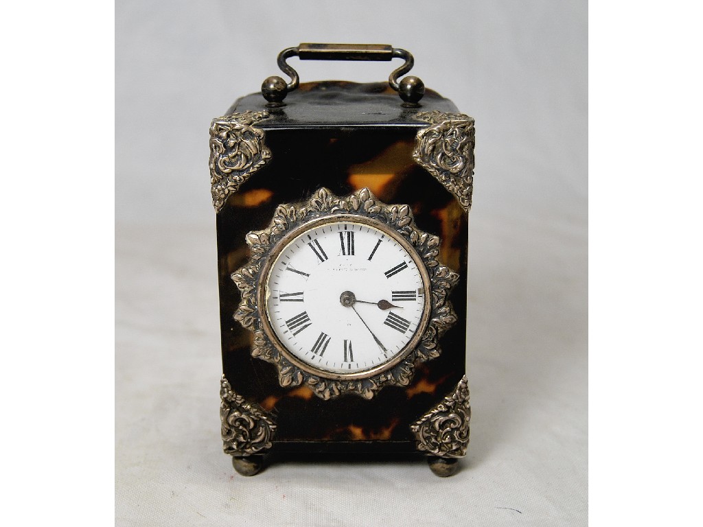 Appraisal: A Victorian tortoiseshell desk clock with silver mounts the brass