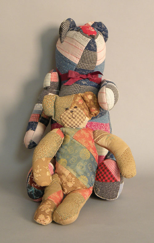 Appraisal: Large patchwork Pooh bear together with a smaller patchwork teddy