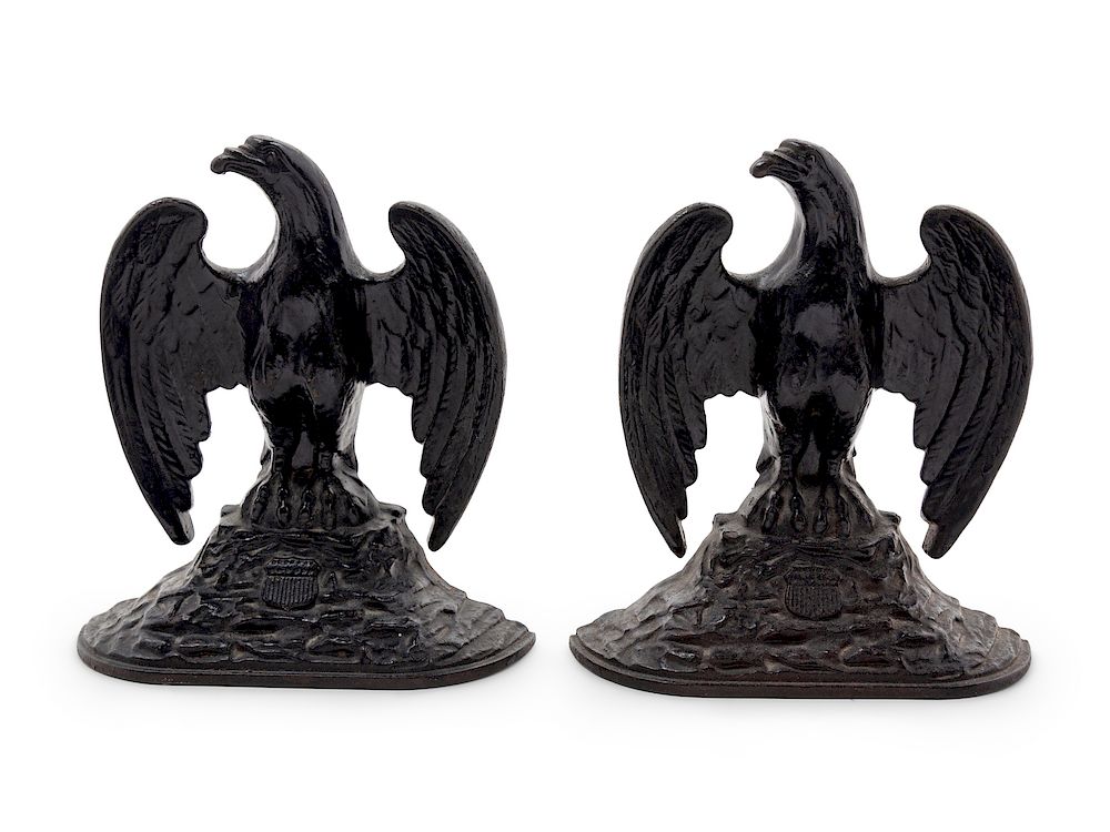 Appraisal: A Pair of Cast Iron Eagle-Form Bookends A Pair of