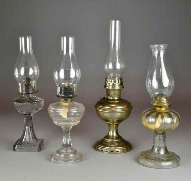 Appraisal: Oil Hurricane Lamps Glass and MetalTo include three glass hurricane