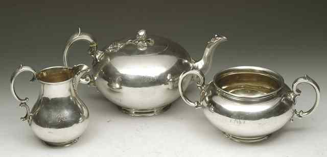 Appraisal: A VICTORIAN SILVER THREE PIECE TEA SET plain bun shaped