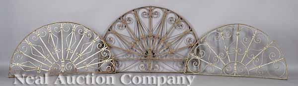 Appraisal: A Set of Six Wrought Iron Over-Door Fanlights with scrolled