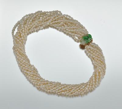 Appraisal: A Twelve Strand Baroque Pearls Necklace with Jadeite Clasp k