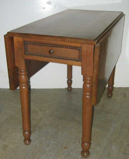 Appraisal: AMERICAN TH CENTURY CHERRY DROP LEAF TABLE Rectangular top with