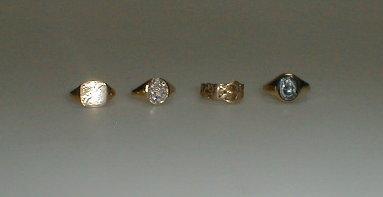 Appraisal: Four assorted gold signet rings