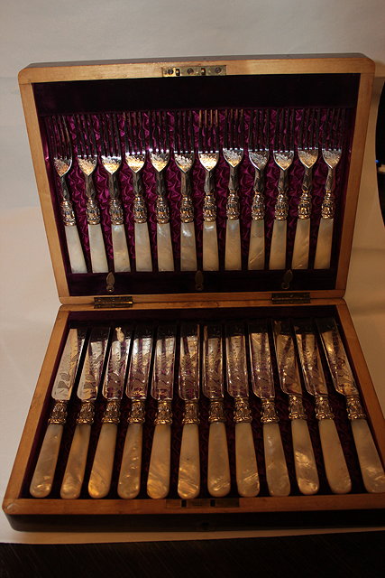 Appraisal: A CASED SET OF DESSERT KNIVES AND FORKS with mother