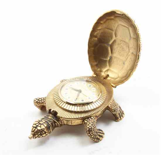 Appraisal: A Cast Gilt Metal Figural Alarm Clock Looping in the