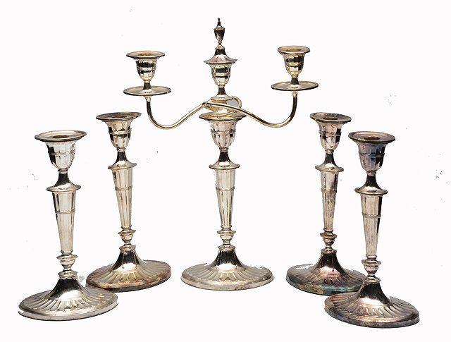 Appraisal: A SET OF FOUR ELECTROPLATED CANDLESTICKS with oval fluted stems