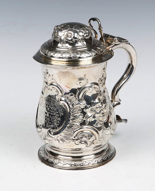 Appraisal: A GEORGE III SILVER TANKARD baluster shaped body with chased