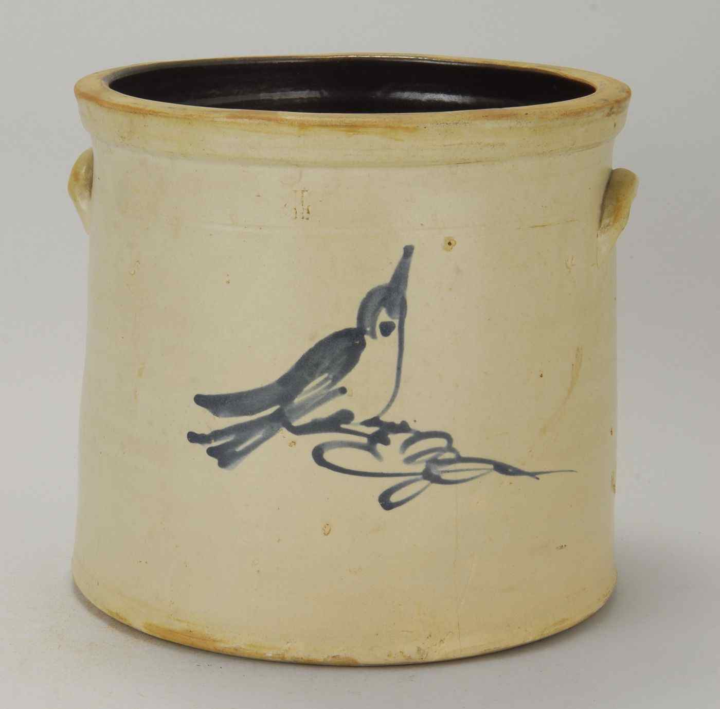 Appraisal: UNMARKED FOUR-GALLON STONEWARE CROCKLate th CenturyWith cobalt bird decoration Height