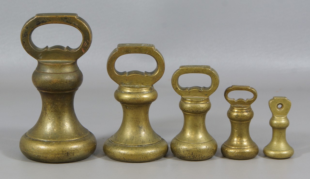 Appraisal: garduated brass scale weights oz to lb tallest smallest one