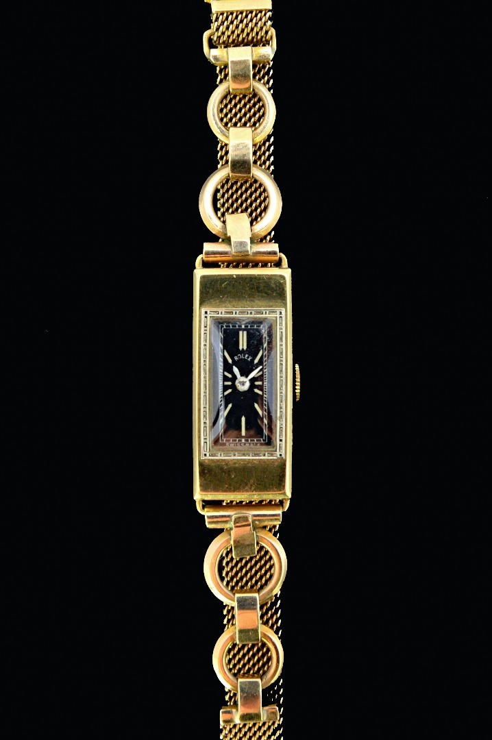 Appraisal: A lady's ct gold rectangular cased Rolex wristwatch the jewelled