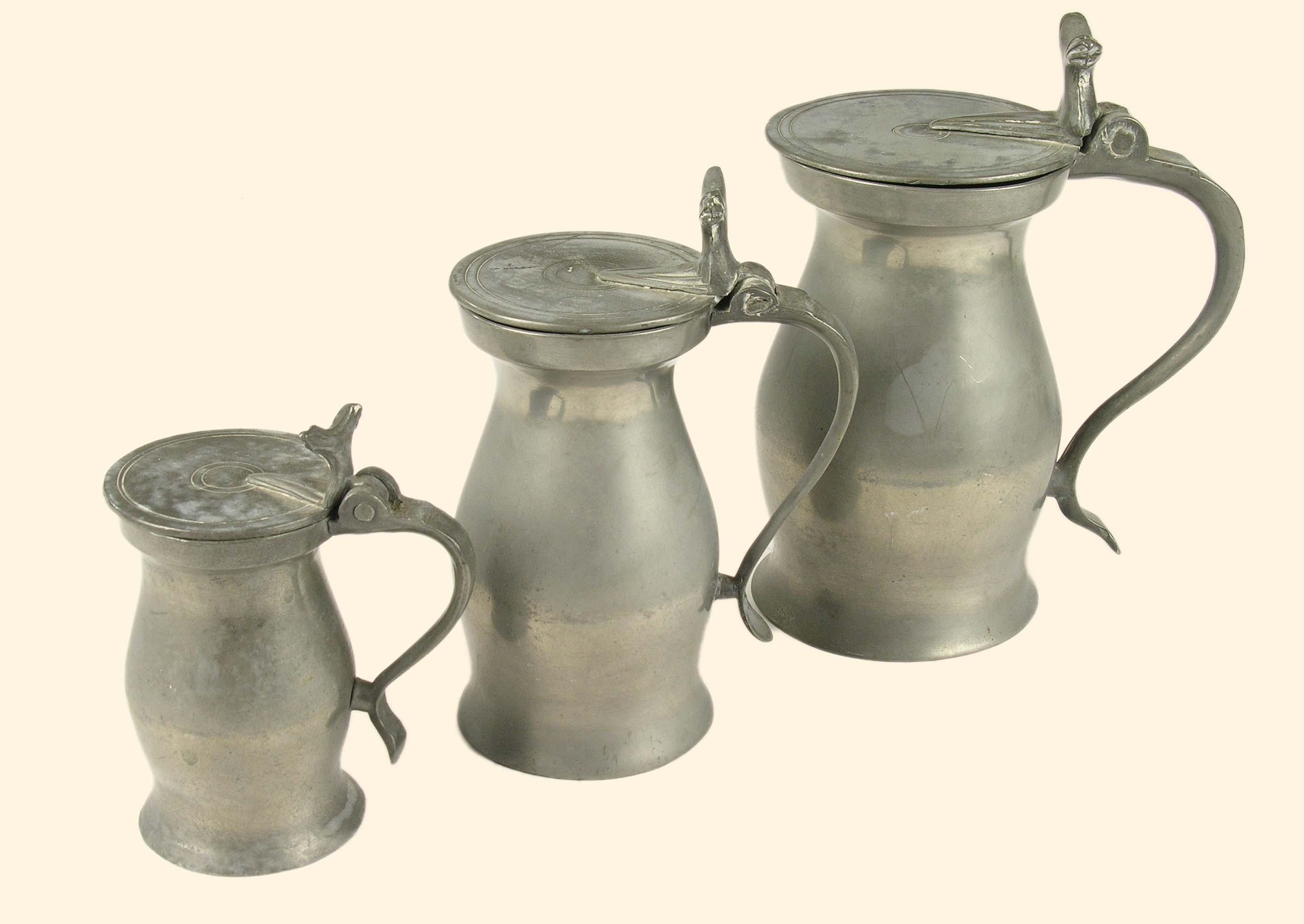 Appraisal: Three graduated pewter bud baluster measures