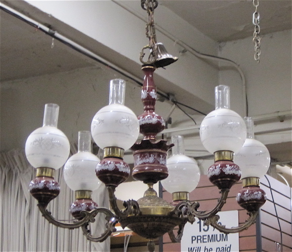 Appraisal: SIX-LIGHT PORCELAIN AND BRASS CHANDELIER the six maroon porcelain kerosene-style