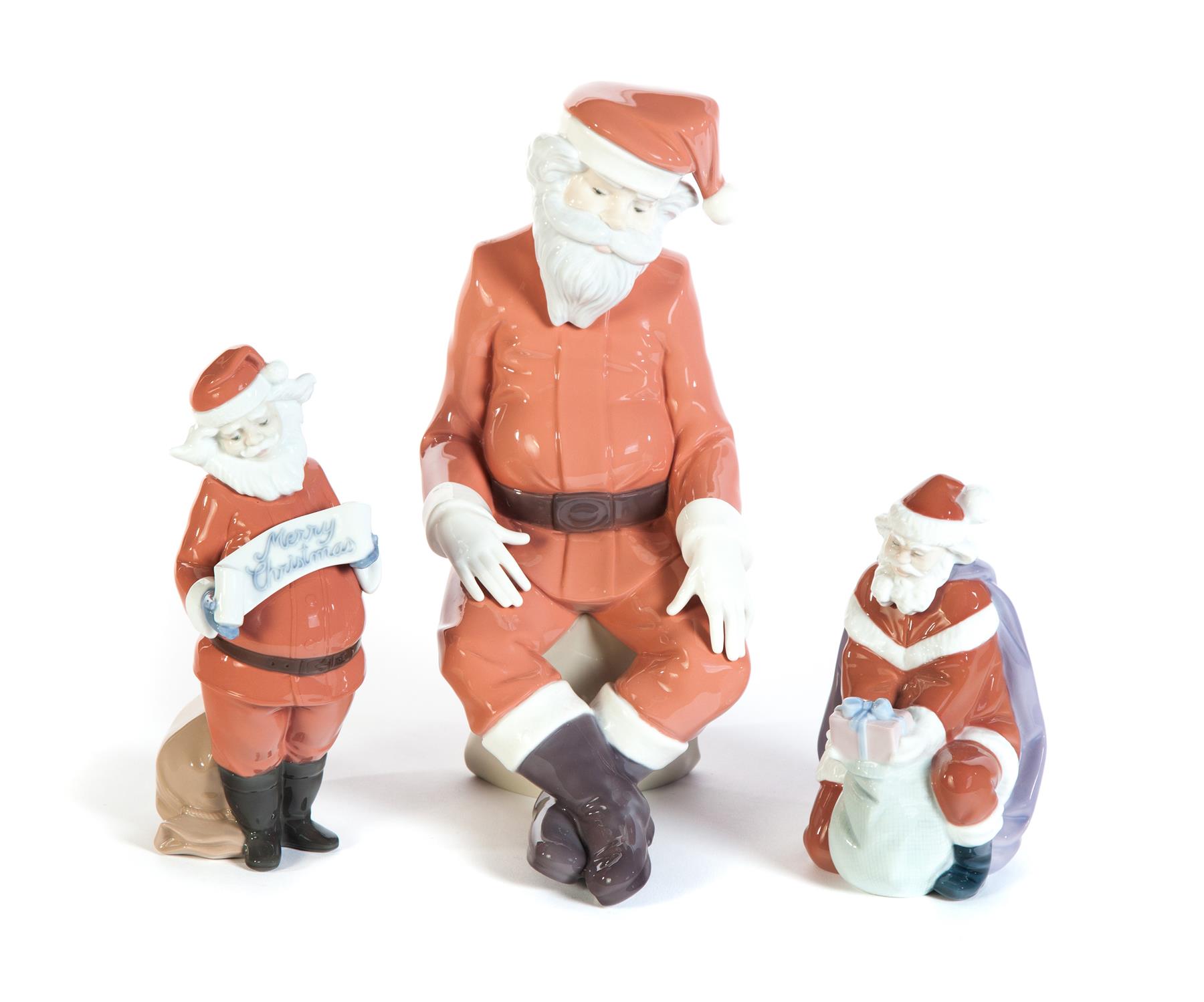 Appraisal: THREE LLADRO SANTA CLAUS FIGURES Spain th century High glaze