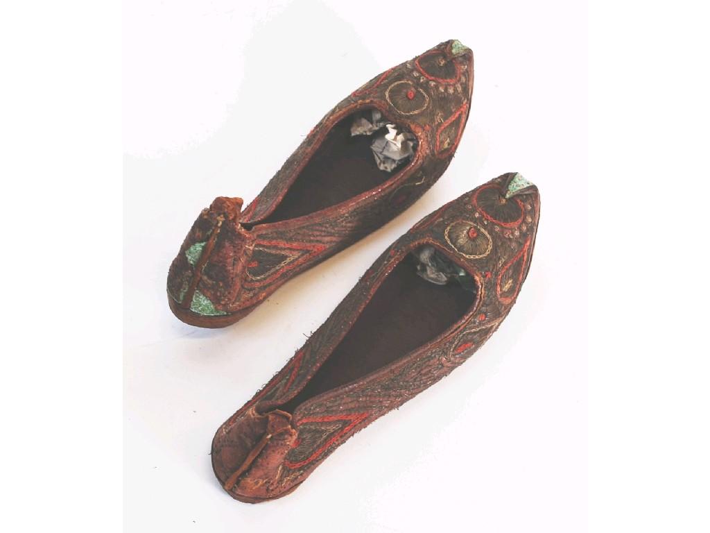 Appraisal: PAIR OF PERSIAN CHILD'S LEATHER SLIPPERS hand worked in silver