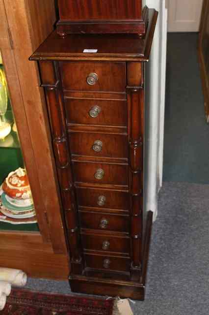 Appraisal: A REPRODUCTION MAHOGANY NARROW TALL CHEST of four drawers each