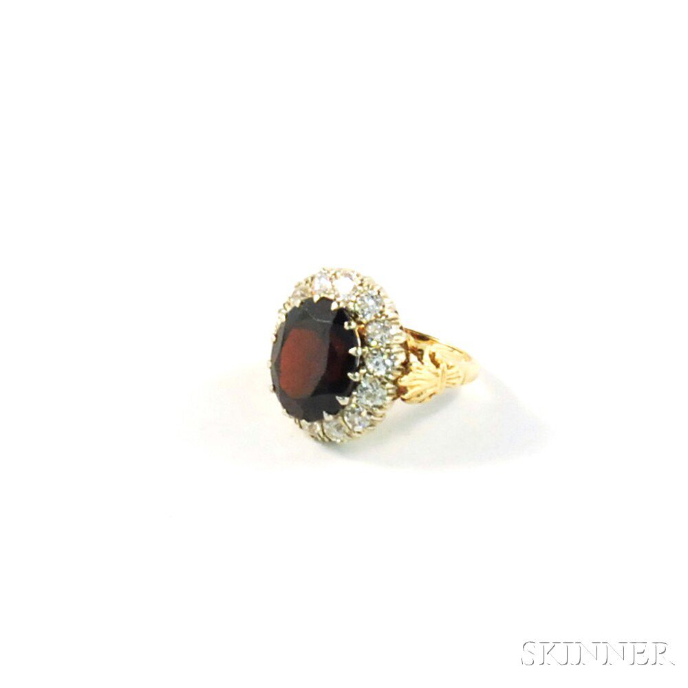 Appraisal: kt Gold Garnet and Diamond Ring the oval-cut garnet measuring