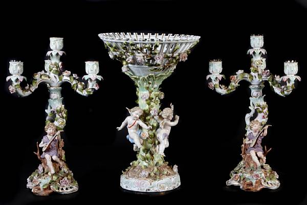 Appraisal: A Plaue porcelain three piece figural garniture comprising a centerpiece