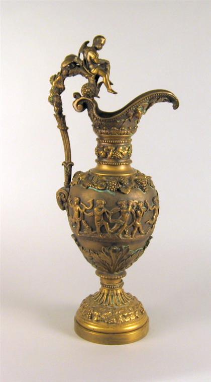 Appraisal: Gilt bronze ewer With ornate cast decoration of a bacchic