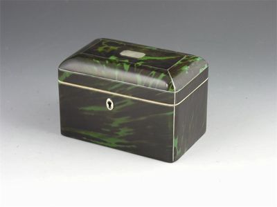 Appraisal: A Regency green tortoiseshell tea caddy with pewter stringing the