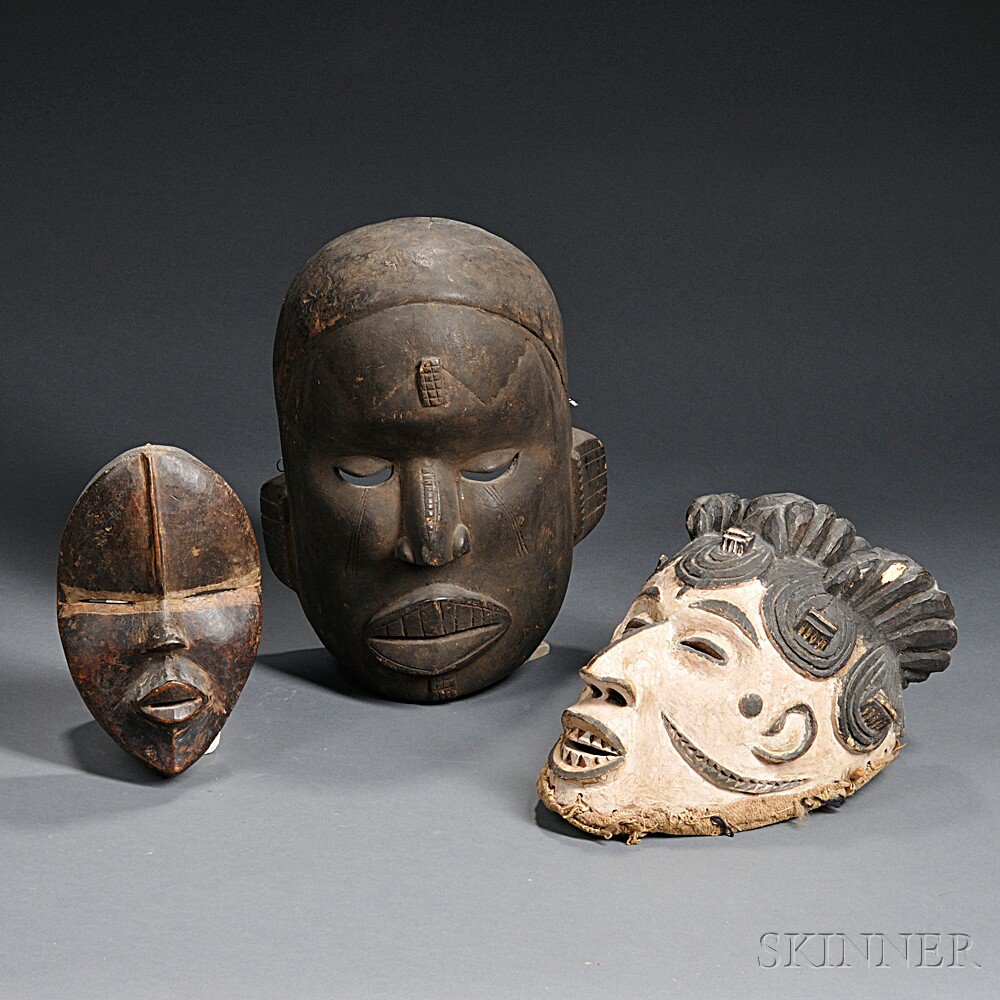 Appraisal: Three African Carved Wood Masks includes a Dan mask and