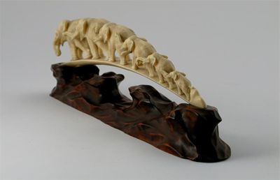 Appraisal: A Chinese ivory tusk elephant bridge carving raised on a