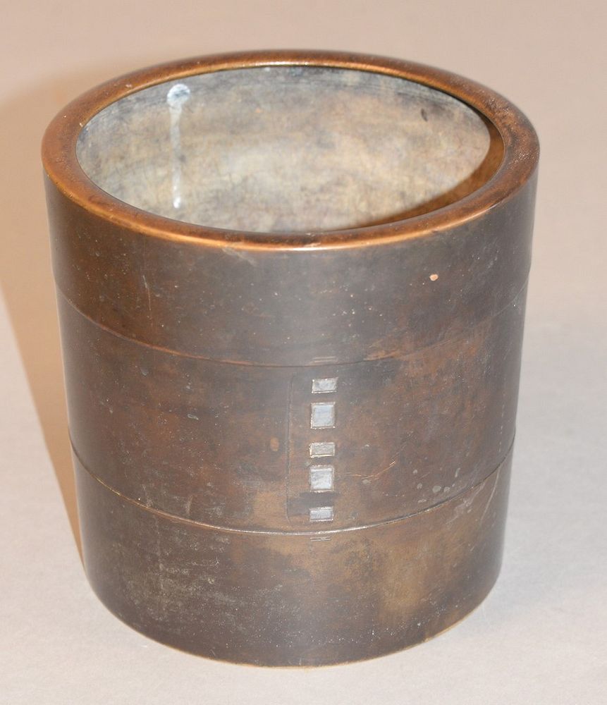 Appraisal: Bronze pot center with five inlaid silver swatches plus two