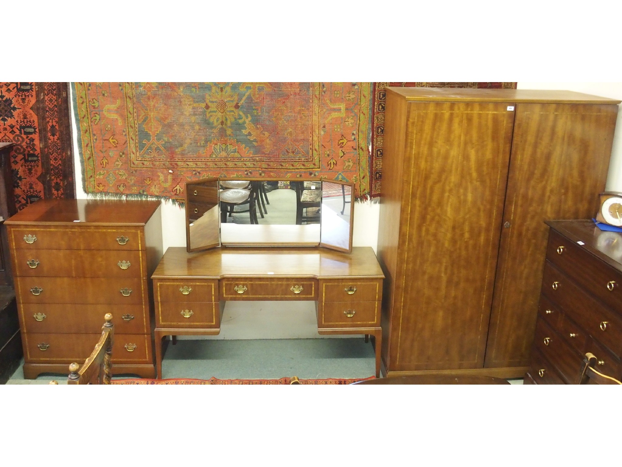 Appraisal: A Beithcraft inlaid mahogany bedroom suite comprising wardrobe dressing table