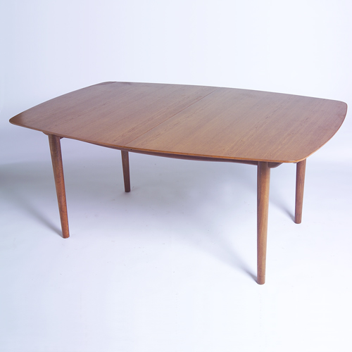 Appraisal: FINN JUHL BAKER Teak extension dining table with boat-shaped top