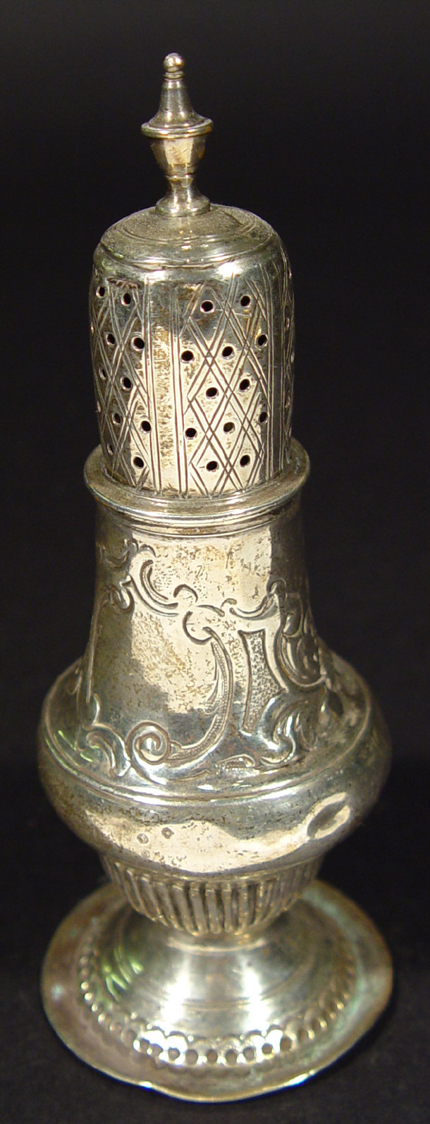 Appraisal: Georgian silver sugar caster with chased and floral embossed decoration