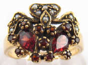 Appraisal: A yellow metal tests carat gold ring set with garnet