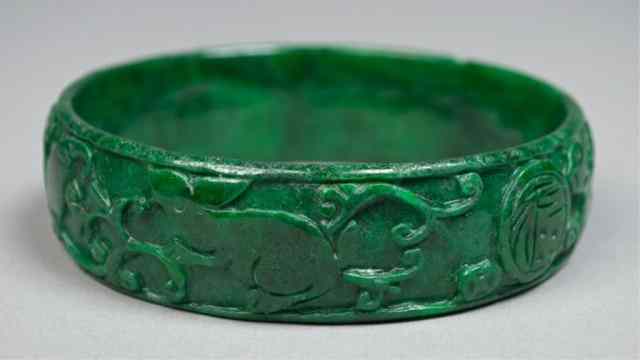 Appraisal: Chinese Carved Jade BangleFinely carved to depict fruit and symbols