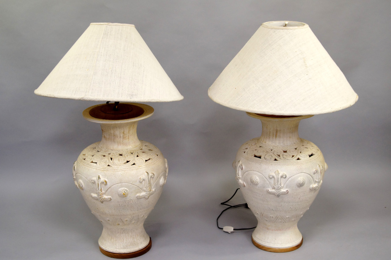 Appraisal: A pair of white glazed pottery table lamps of baluster