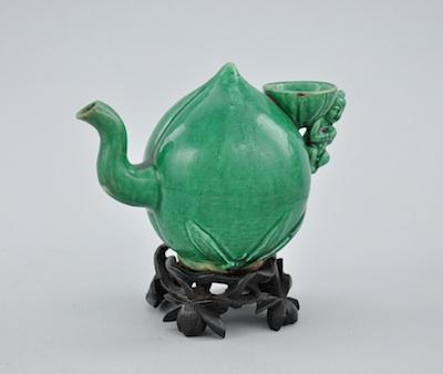 Appraisal: An Emerald Green Glazed Ceramic Water Dropper In the shape