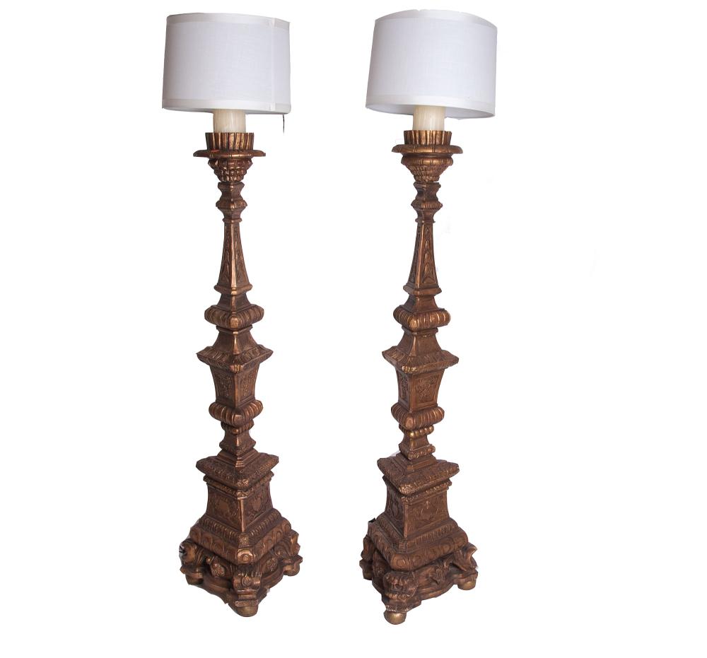 Appraisal: PAIR OF ITALIAN BAROQUE STYLE GILT TORCHERESeach electrified as a