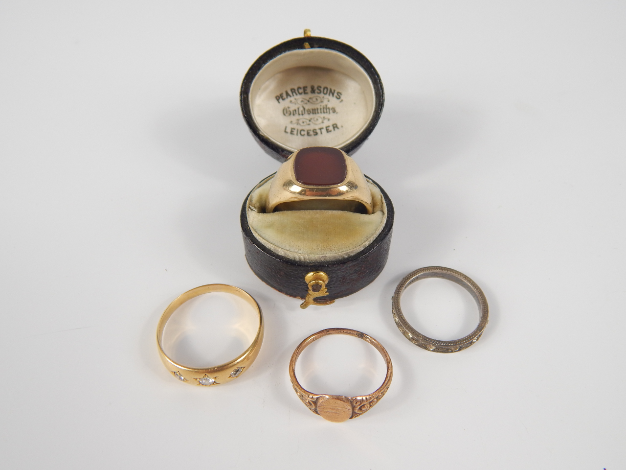 Appraisal: A ct gold signet ring set with an uncut hard