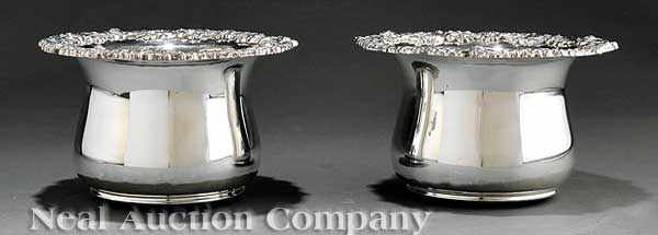 Appraisal: A Pair of Monumental Silverplate Bottle Coasters with gadrooned foliate