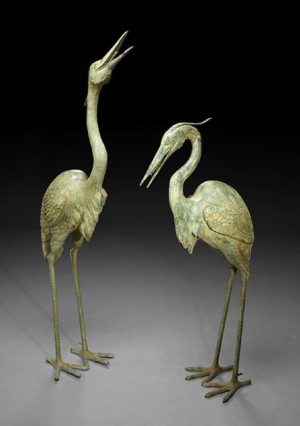 Appraisal: A pair of patinated bronze models of cranes as fountains