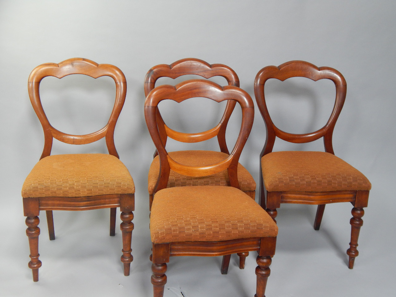 Appraisal: A set of four Victorian mahogany balloon back dining chairs