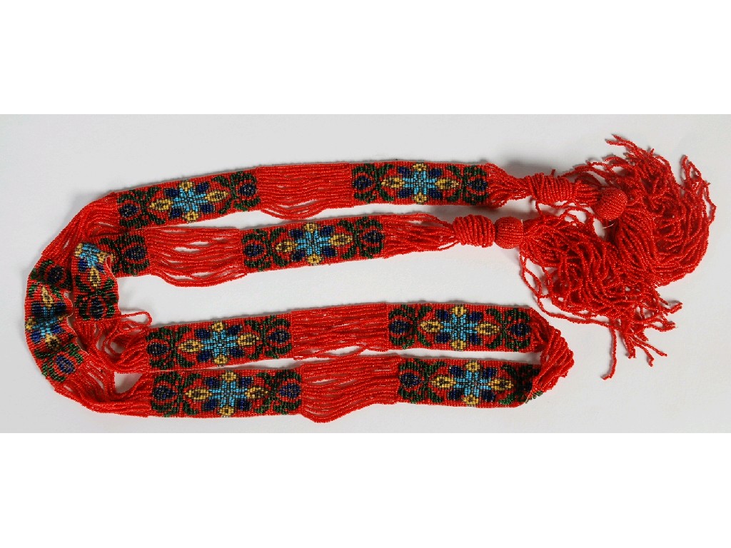 Appraisal: 's LONG CRIMSON AND FLORAL PATTERED BEADWORK COLLAR with tasselled