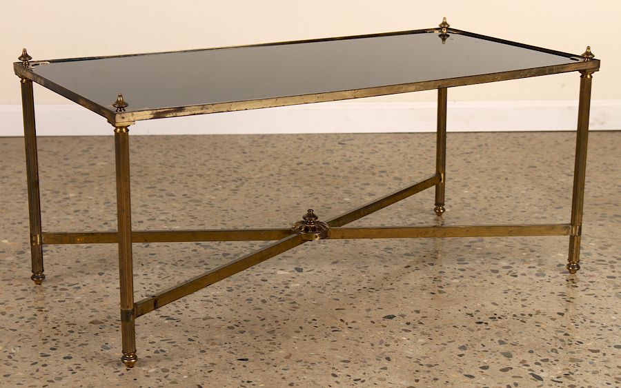 Appraisal: BRASS COFFEE TABLE WITH BLACK GLASS TOP A brass coffee