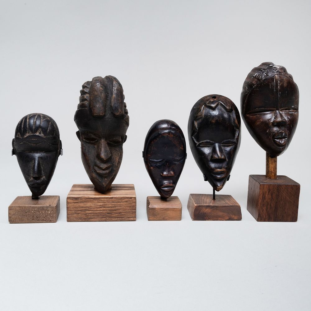 Appraisal: Group of Twenty-One African Wood Passport Masks The largest mask