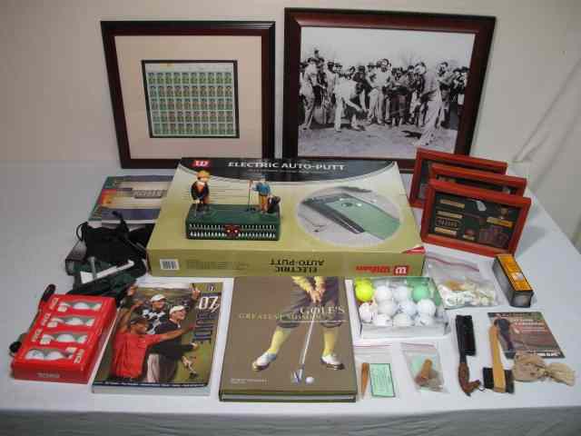 Appraisal: Large lot of assorted golf collectibles Includes an electric auto-putt