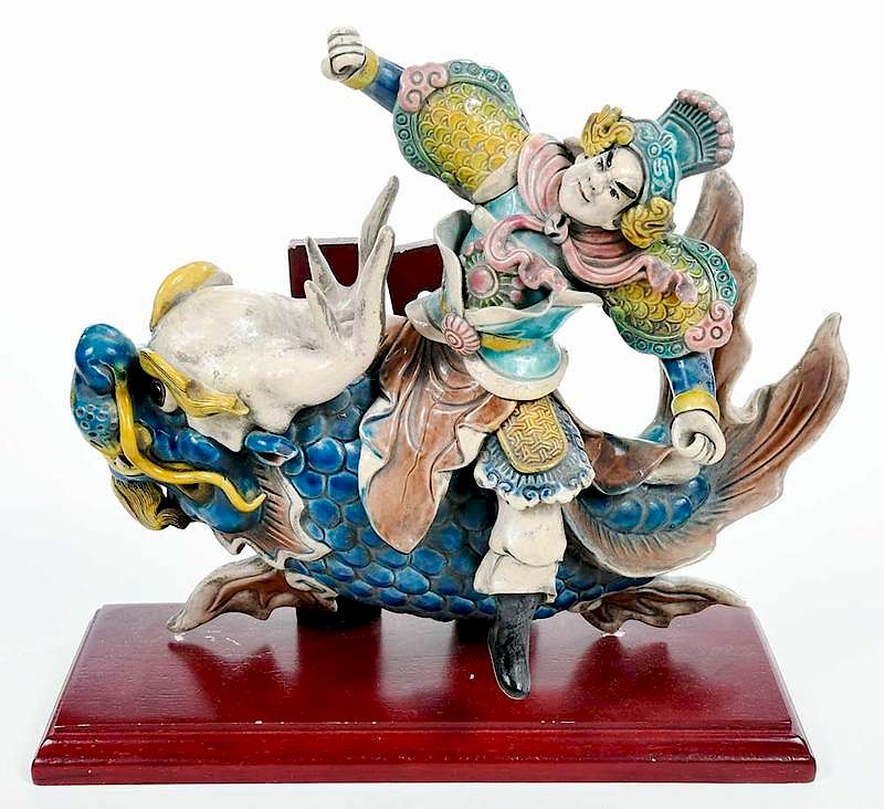 Appraisal: Chinese Roof Tile on Stand polychrome ceramic figure riding a