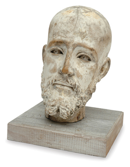 Appraisal: A SPANISH LIMED AND CARVED WOODEN HEAD OF A MAN