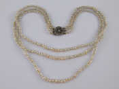 Appraisal: A three row untested seed pearl necklace largest pearls approx